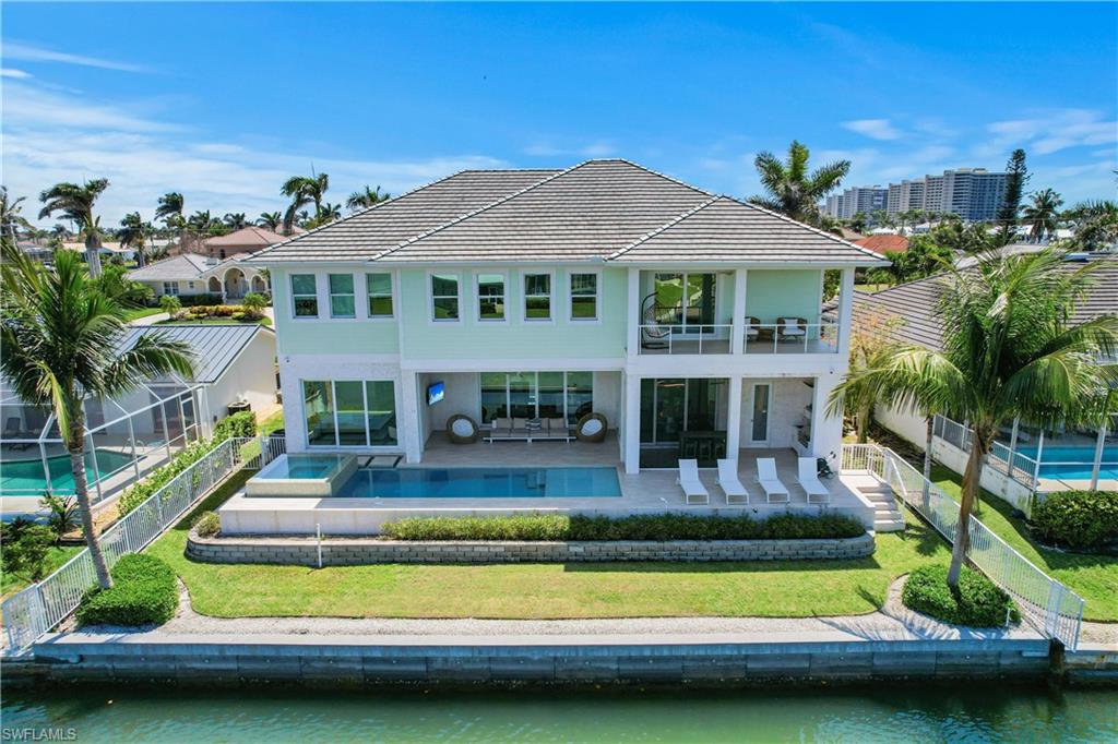 549 Hernando Drive Marco Island, FL 34145 - Photo 2 of 34 a view of a house with swimming pool