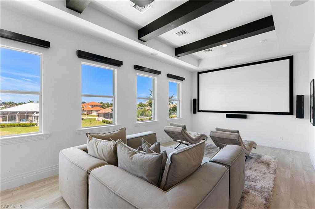 549 Hernando Drive Marco Island, FL 34145 - Photo 21 of 34 a living room with furniture and a flat screen tv