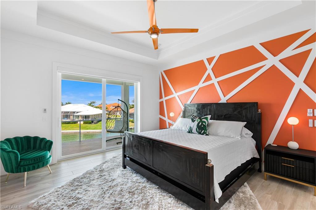549 Hernando Drive Marco Island, FL 34145 - Photo 23 of 34 a bed room with a bed and a chair