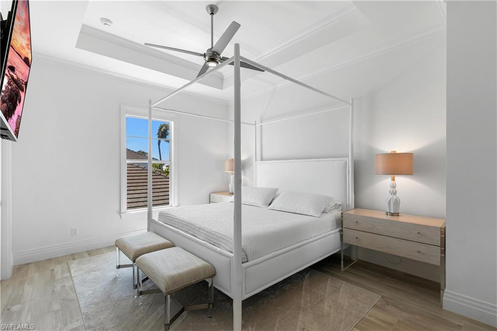 549 Hernando Drive Marco Island, FL 34145 - Photo 26 of 34 a bedroom with a bed window and a ceiling fan