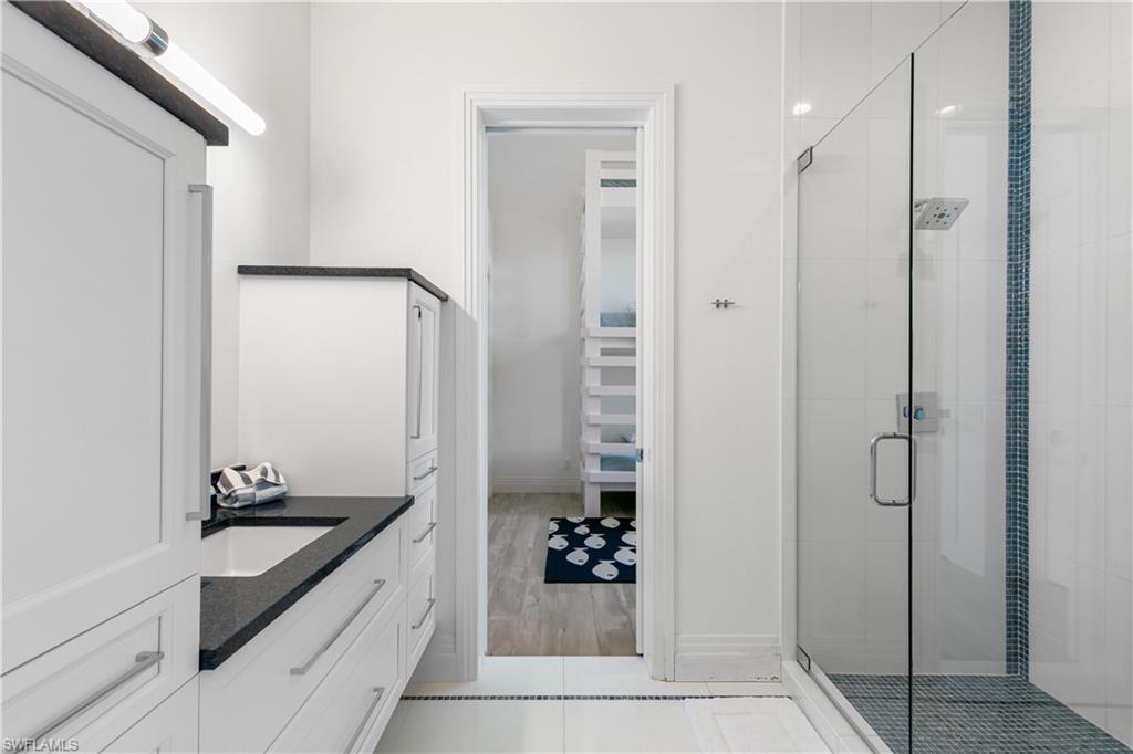 549 Hernando Drive Marco Island, FL 34145 - Photo 30 of 34 a spacious bathroom with a shower and a sink