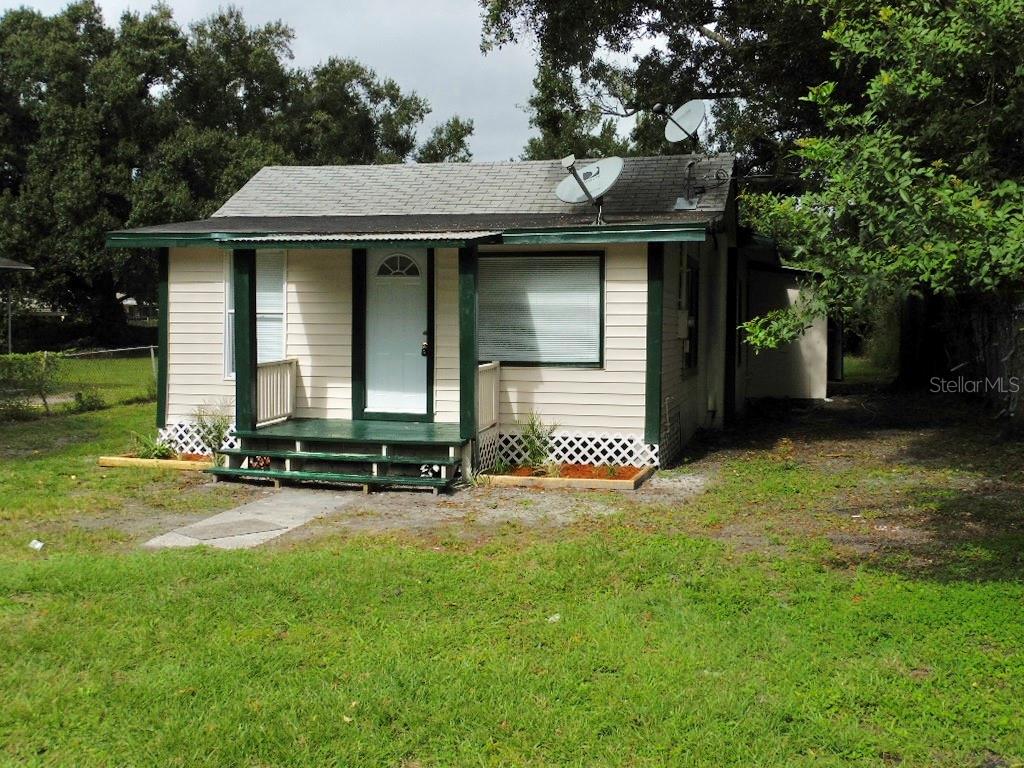 2113 Marjorie Road Lakeland, FL 33815 - Photo 1 of 1 a front view of a house with a yard and garage