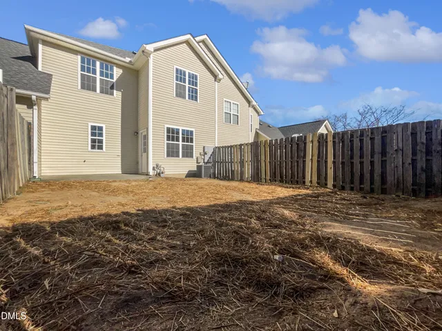 a view of a backyard of the house