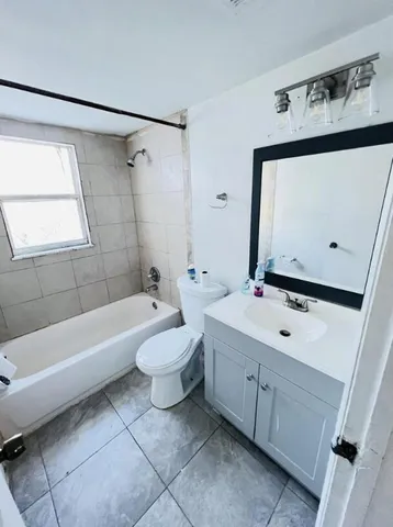 a bathroom with a sink a toilet and a bathtub