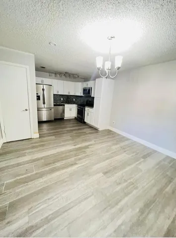 a view of a livingroom with a furniture