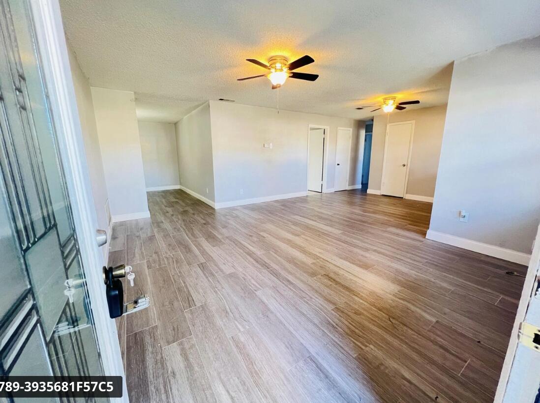 901 Hickory Street, Unit A Fort Pierce, FL 34947 - Photo 7 of 7 wooden floor in an empty room