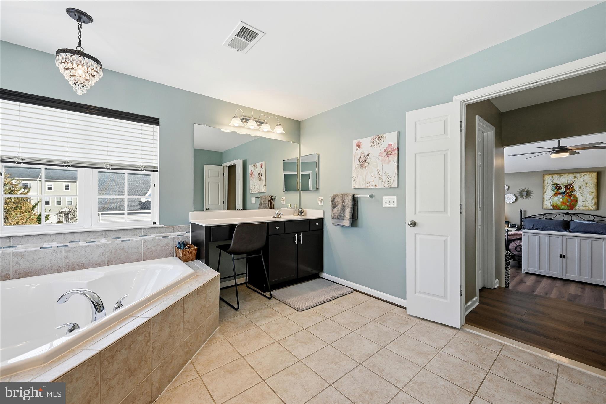 105 Garret Court Stephenson, VA 22656 - Photo 39 of 97 a spacious bathroom with a tub sink and mirror