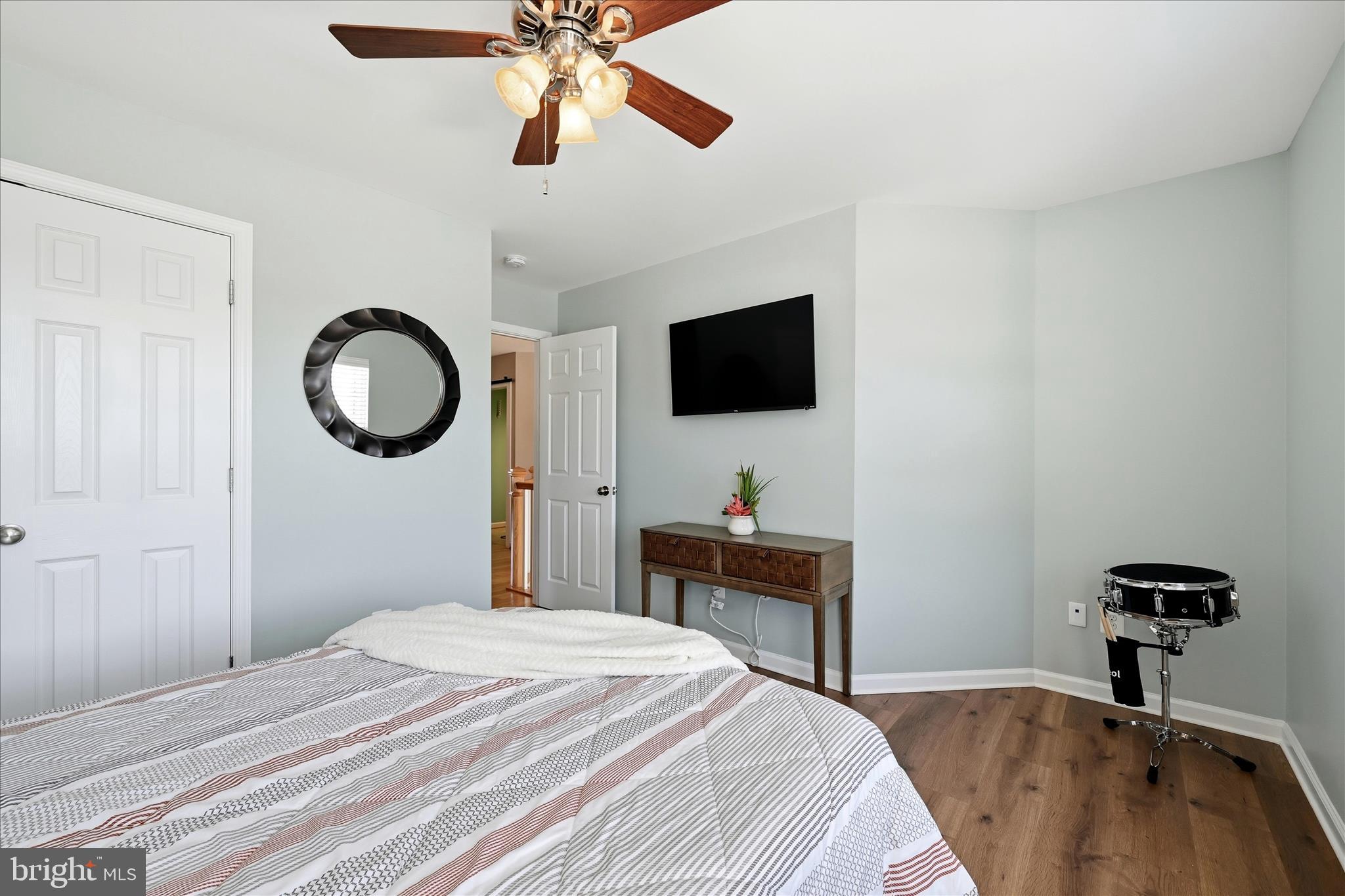 105 Garret Court Stephenson, VA 22656 - Photo 43 of 97 a bedroom with a bed and a chandelier