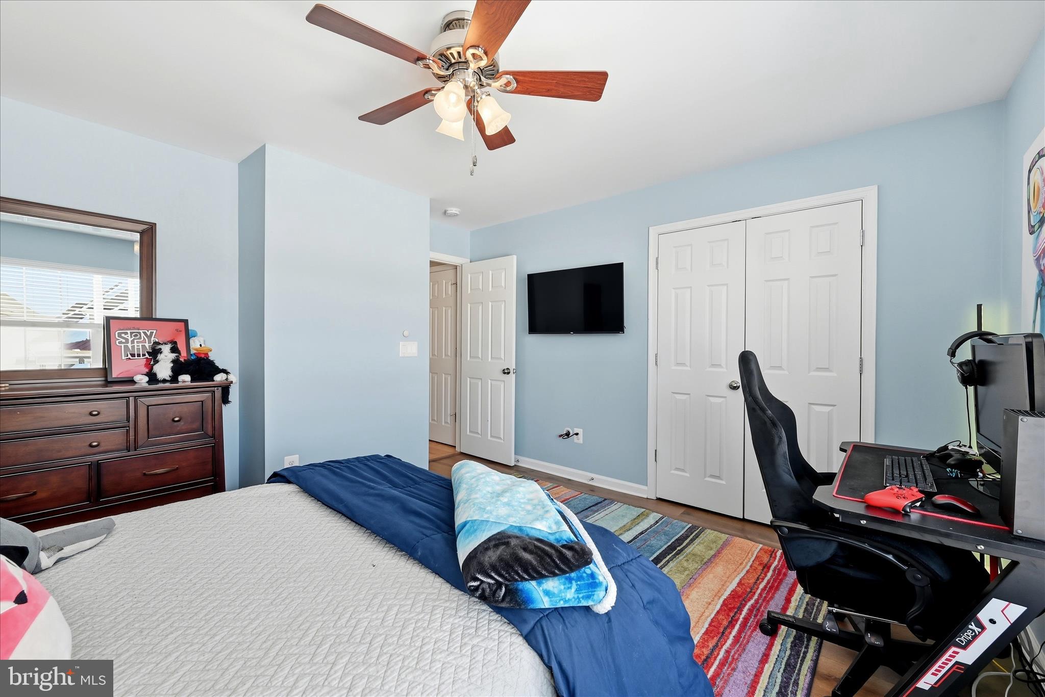 105 Garret Court Stephenson, VA 22656 - Photo 46 of 97 a bedroom with a bed and a flat screen tv