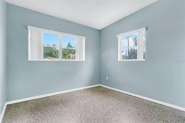 an empty room with windows