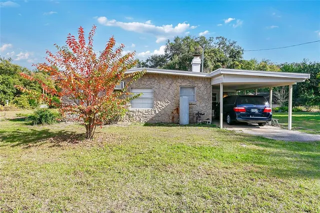a view of a house with a big yard