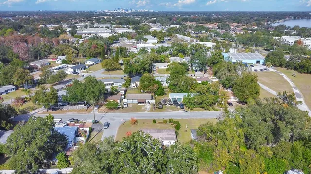 an aerial view of house with outdoor space and swimming pool