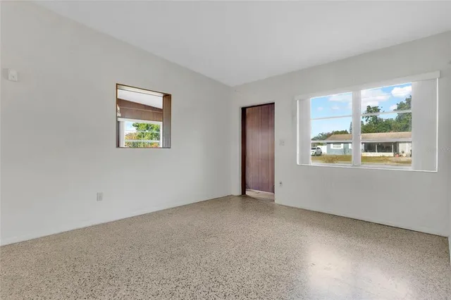 a view of an empty room with a window