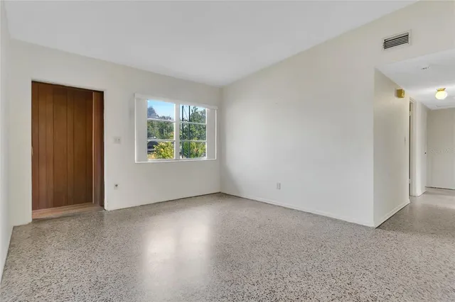 an empty room with windows