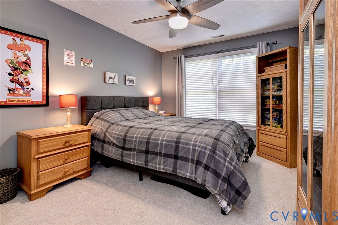 4015 Cold Spring Road Williamsburg, VA 23188 - Photo 33 of 57 Carpeted room with a ceiling fan, window with blin