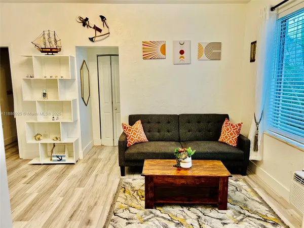a living room with furniture and a table