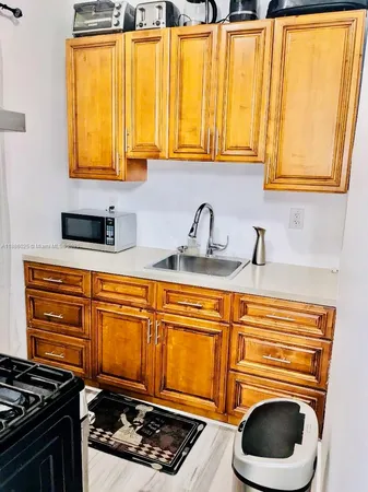 a kitchen with sink and window