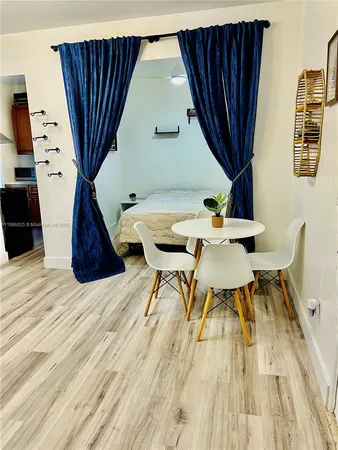 a workspace with furniture window and wooden floor