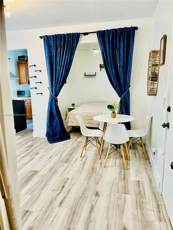 a view of livingroom with furniture and wooden floor