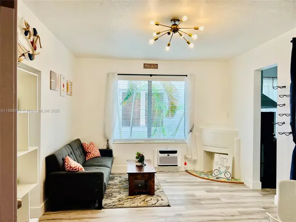 a living room with furniture and a window