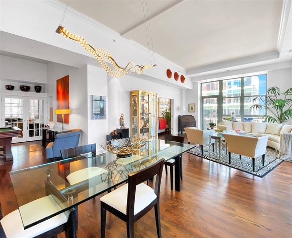 165 North Canal Street, Unit 1412 Chicago, IL 60606 - Photo 11 of 38 a view of a dining room with furniture window and wooden floor