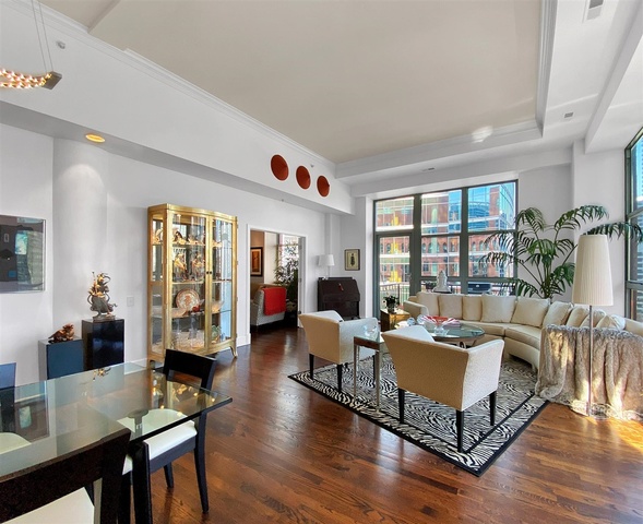 165 North Canal Street, Unit 1412 Chicago, IL 60606 - Photo 16 of 38 a living room with furniture large window and wooden floor