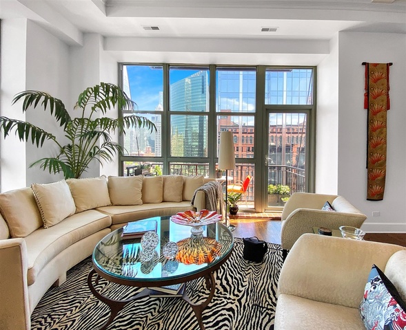 165 North Canal Street, Unit 1412 Chicago, IL 60606 - Photo 17 of 38 a living room with furniture floor to ceiling window and a potted plant