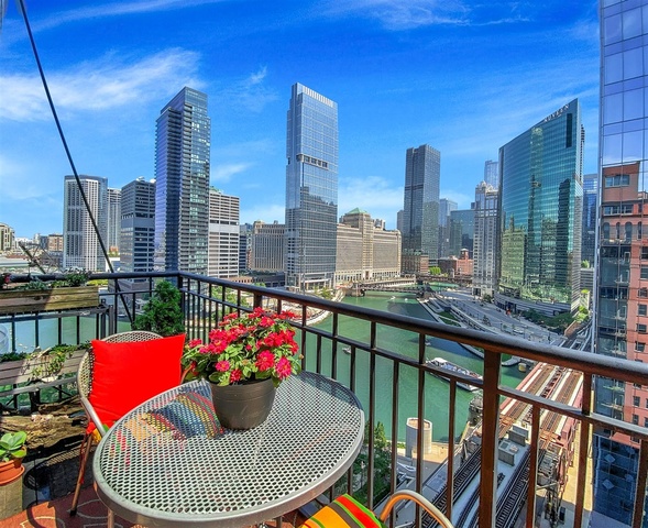 165 North Canal Street, Unit 1412 Chicago, IL 60606 - Photo 19 of 38 a view of balcony with a potted plant and outdoor seating