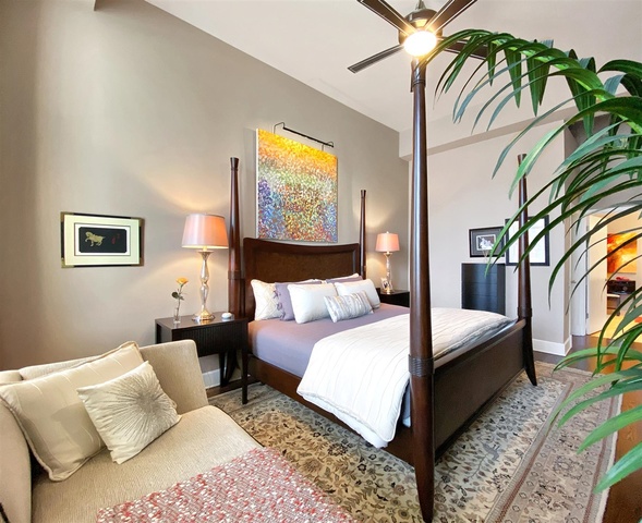 165 North Canal Street, Unit 1412 Chicago, IL 60606 - Photo 22 of 38 a bed room with a bed and a painting on the wall