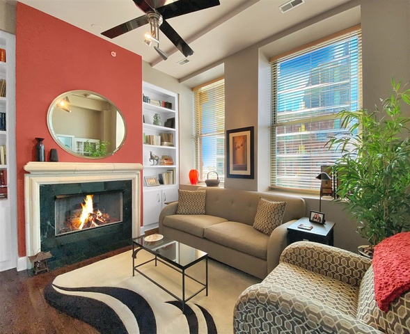 165 North Canal Street, Unit 1412 Chicago, IL 60606 - Photo 27 of 38 a living room with furniture and a fireplace