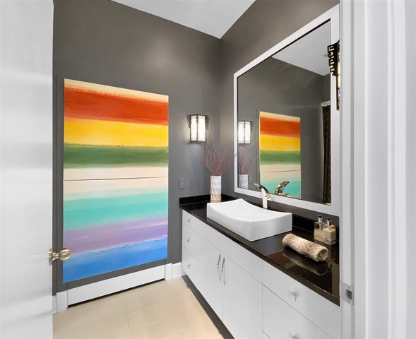 165 North Canal Street, Unit 1412 Chicago, IL 60606 - Photo 29 of 38 a bathroom with a sink and a large mirror next to a window