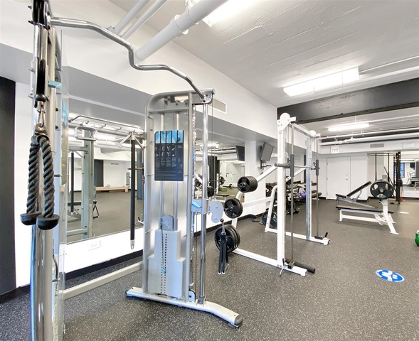 165 North Canal Street, Unit 1412 Chicago, IL 60606 - Photo 35 of 38 a view of a room with gym equipment