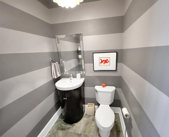 165 North Canal Street, Unit 1412 Chicago, IL 60606 - Photo 7 of 38 a bathroom with a sink mirror and toilet