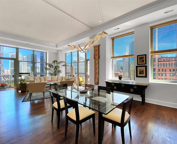 165 North Canal Street, Unit 1412 Chicago, IL 60606 - Photo 10 of 38 a dining room with furniture window and wooden floor