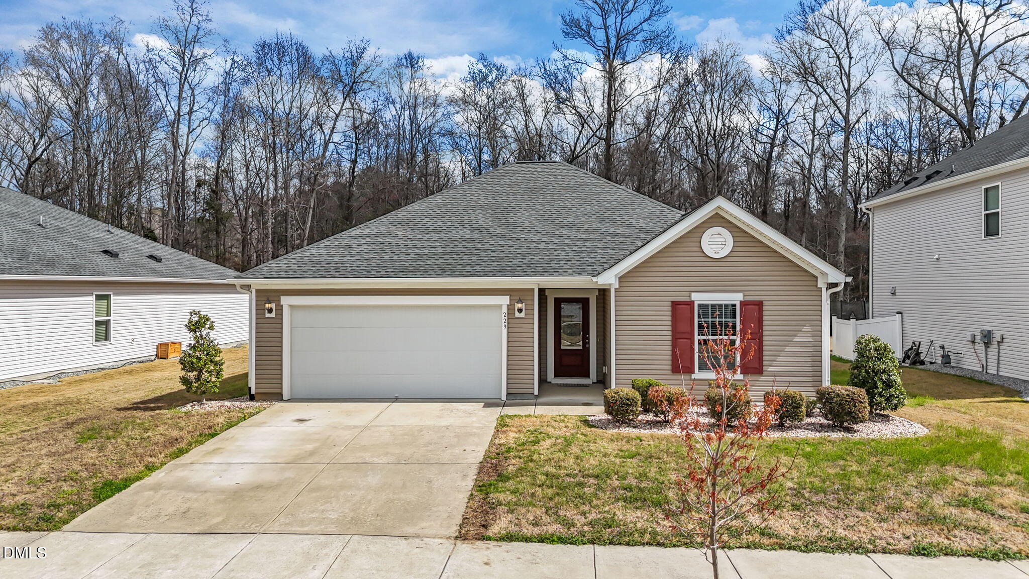 229 Summer Ranch Drive Fuquay-Varina, NC 27526 - Photo 1 of 35 a front view of a house with garden