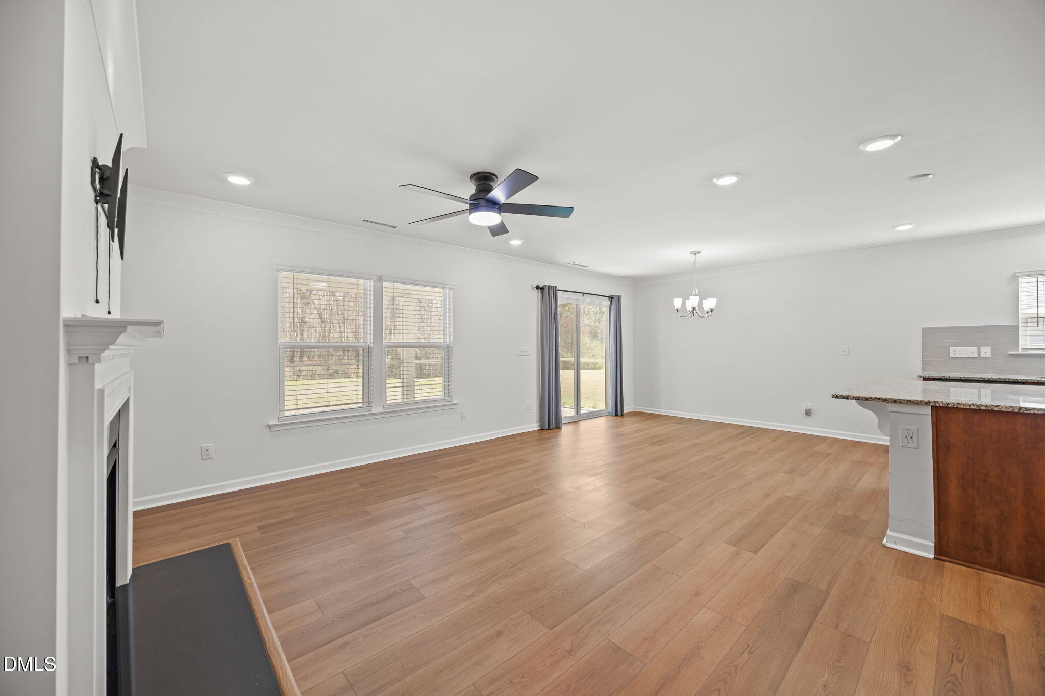 229 Summer Ranch Drive Fuquay-Varina, NC 27526 - Photo 14 of 35 a view of an empty room with a window and wooden floor