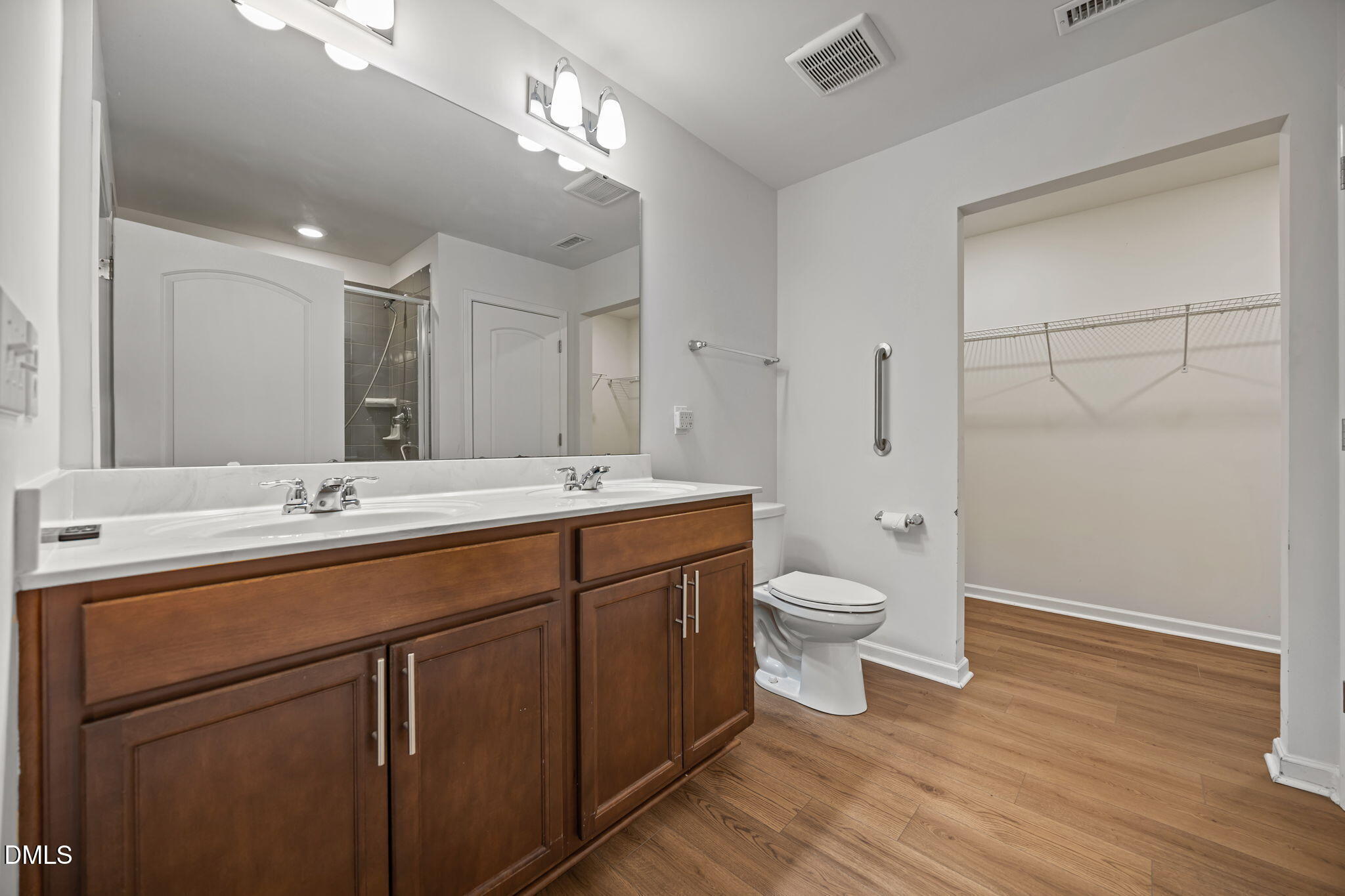 229 Summer Ranch Drive Fuquay-Varina, NC 27526 - Photo 17 of 35 a bathroom with a double vanity sink and a toilet