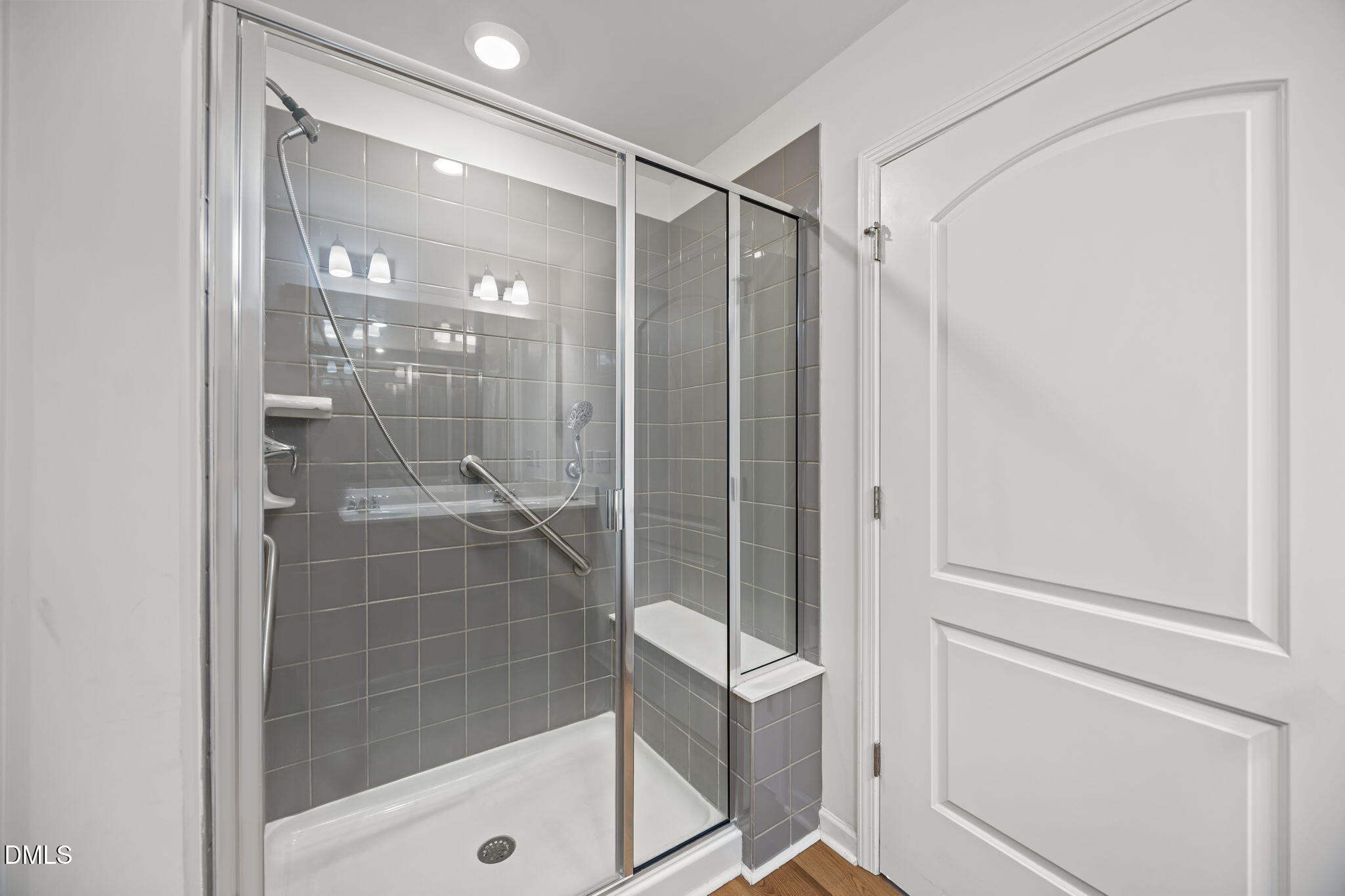 229 Summer Ranch Drive Fuquay-Varina, NC 27526 - Photo 18 of 35 a bathroom with a glass shower door