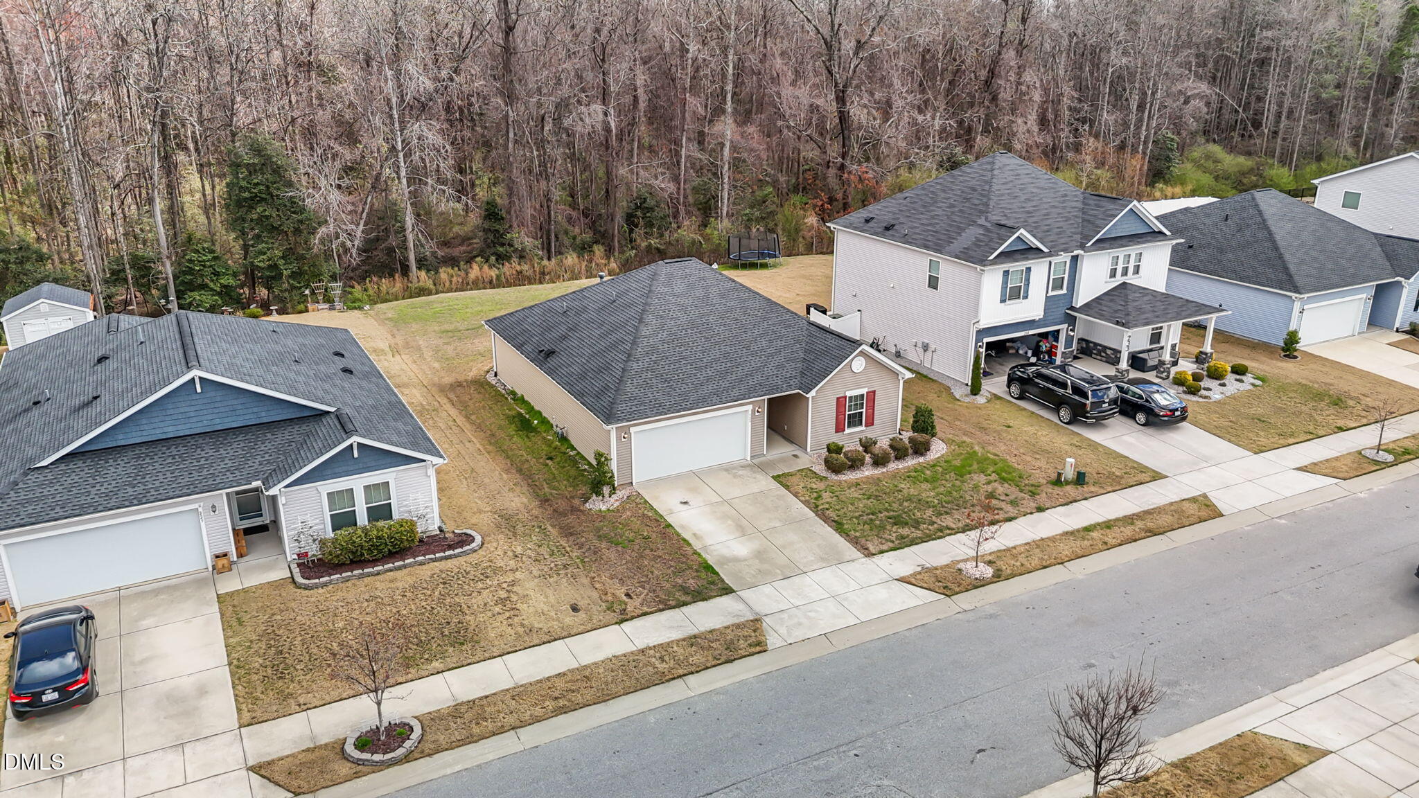229 Summer Ranch Drive Fuquay-Varina, NC 27526 - Photo 30 of 35 an aerial view of a house with garden space and a car parked