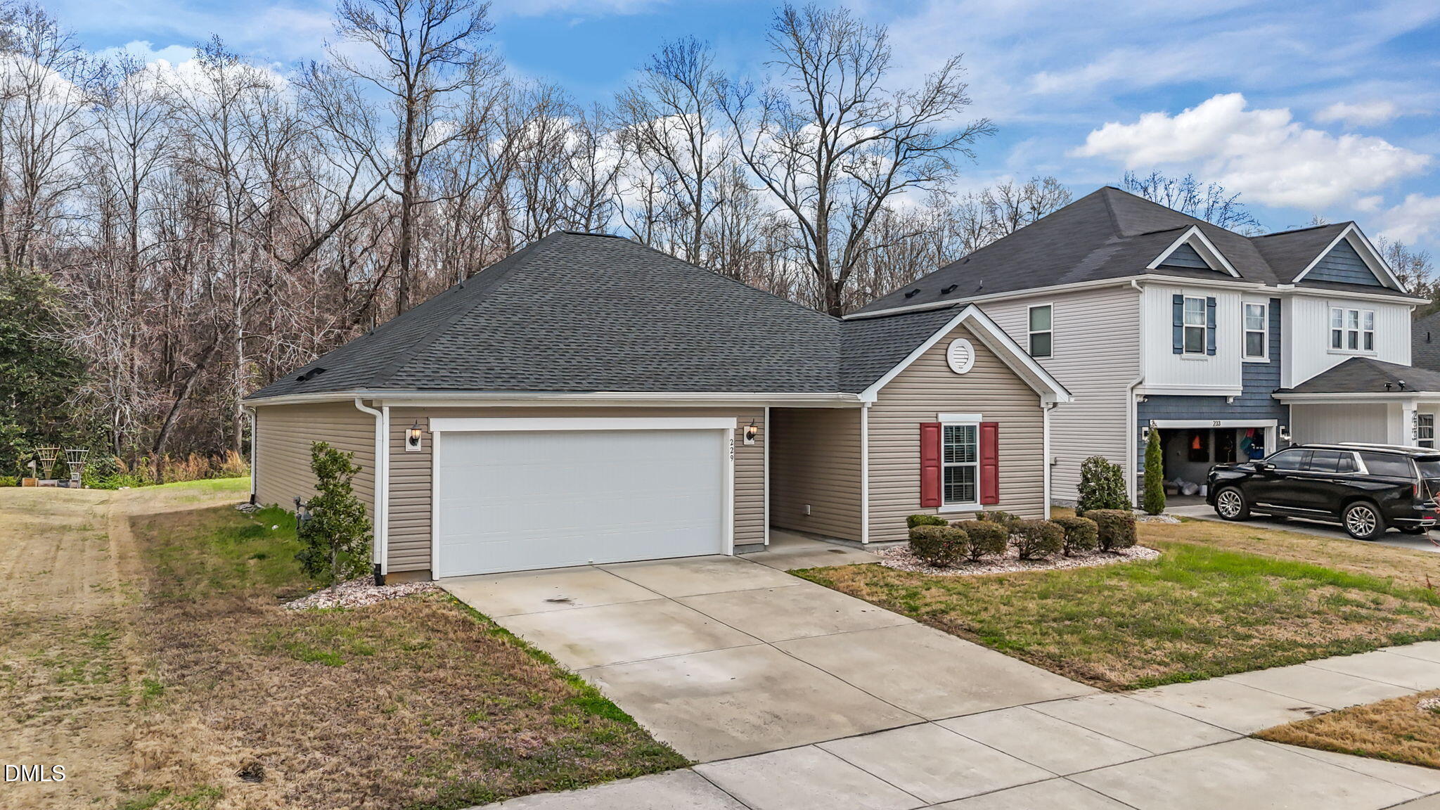 229 Summer Ranch Drive Fuquay-Varina, NC 27526 - Photo 34 of 35 a front view of a house with a yard and garage