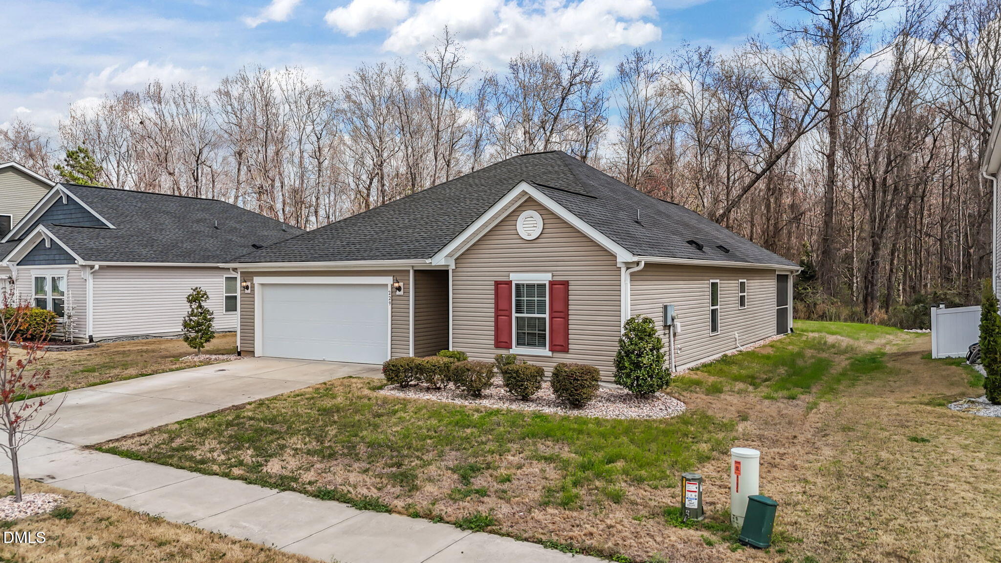 229 Summer Ranch Drive Fuquay-Varina, NC 27526 - Photo 35 of 35 a view of a yard in front of a house with large windows