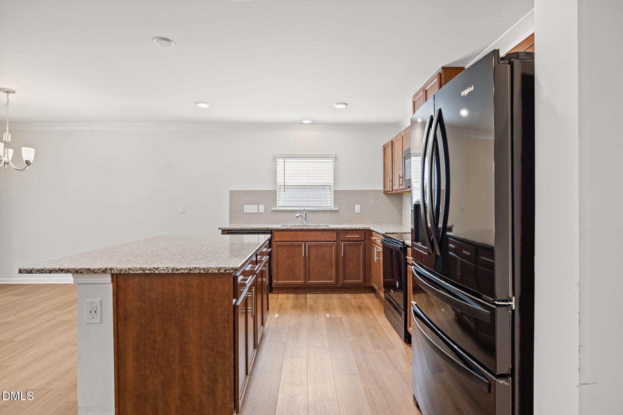 229 Summer Ranch Drive Fuquay-Varina, NC 27526 - Photo 5 of 35 a kitchen with a refrigerator and countertop