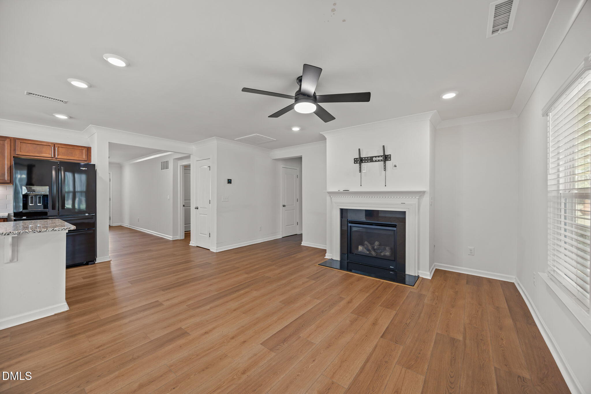 229 Summer Ranch Drive Fuquay-Varina, NC 27526 - Photo 8 of 35 a view of a livingroom with a fireplace and window
