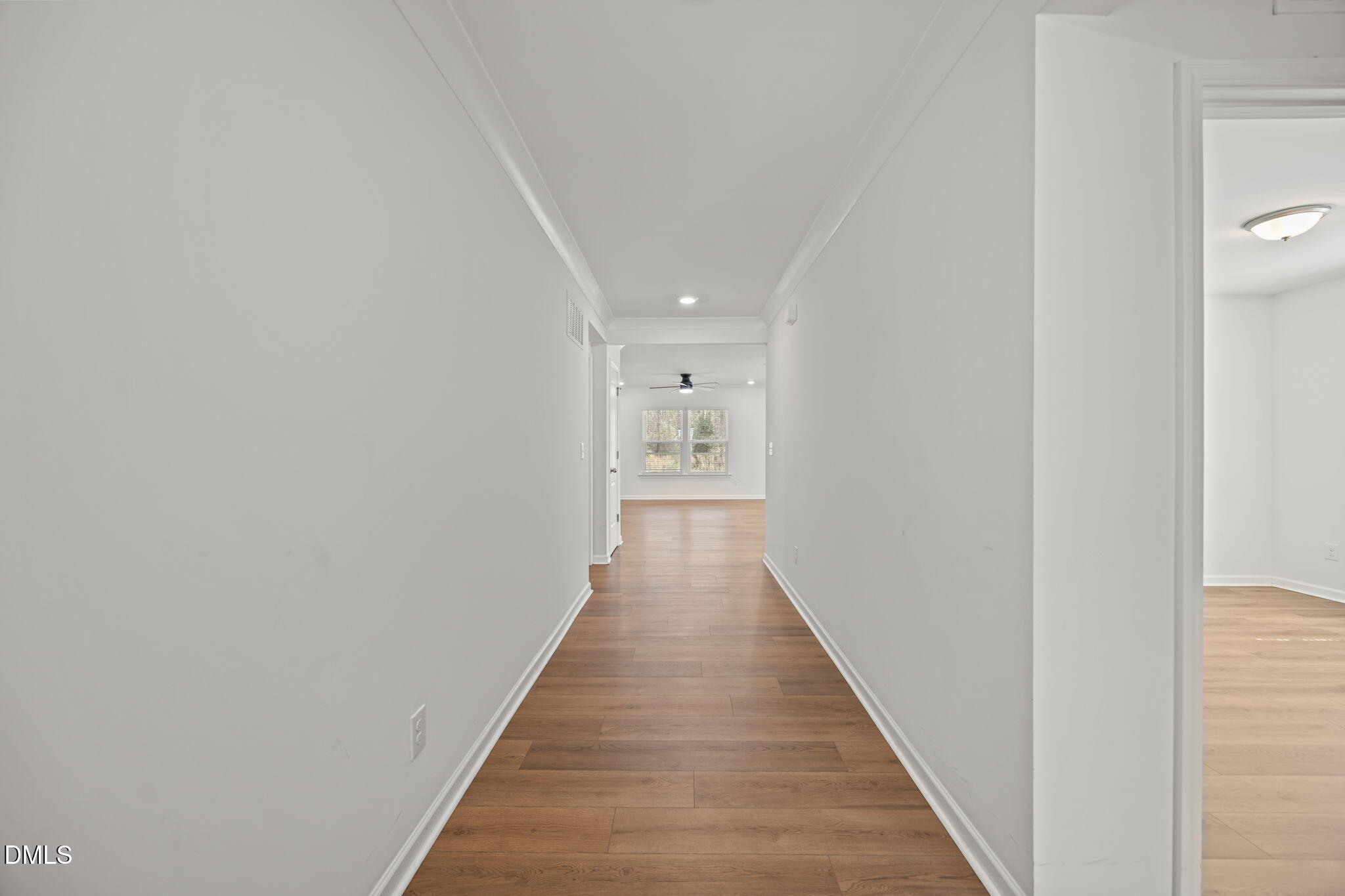 229 Summer Ranch Drive Fuquay-Varina, NC 27526 - Photo 10 of 35 a view of a hallway with wooden floor