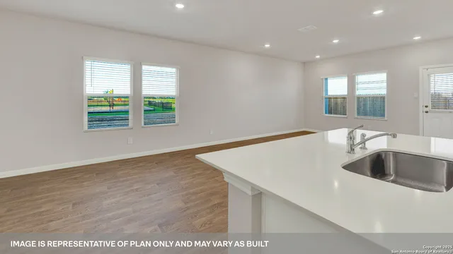 a kitchen with sink and window