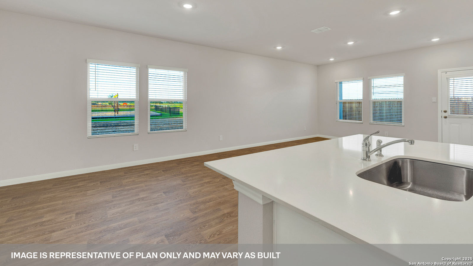 141 Raymondville Path San Marcos, TX 78666 - Photo 13 of 46 a kitchen with a sink and wooden floor