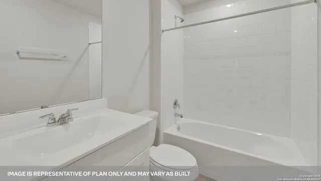 a bathroom with a toilet a sink and a bathtub