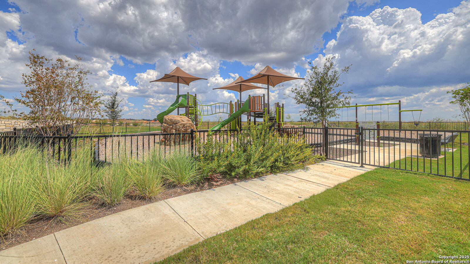 141 Raymondville Path San Marcos, TX 78666 - Photo 44 of 46 a view of a lake with a garden