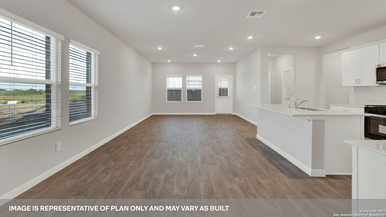 141 Raymondville Path San Marcos, TX 78666 - Photo 6 of 46 a view of an empty room with wooden floor and a window
