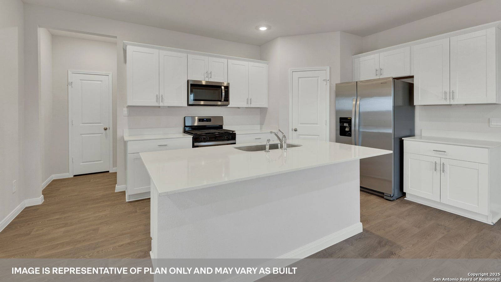 141 Raymondville Path San Marcos, TX 78666 - Photo 10 of 46 a kitchen with stainless steel appliances a refrigerator stove microwave and sink